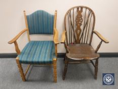 A blonde oak armchair and an oak wheel back armchair