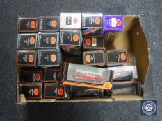 A box containing twenty-two boxed exclusive first editions of die cast buses