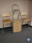 A pine effect office chest and three bar stools