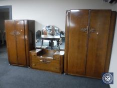 A mid 20th century oak three piece bedroom suite