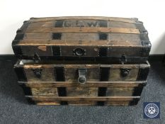 An early 20th century wooden bound dome top shipping trunk