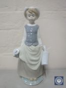 A Lladro figure of a water carrier
