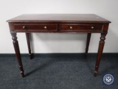 A Victorian mahogany side table fitted two drawers