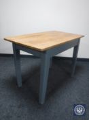 A pine kitchen table on painted base
