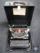 A cased vintage Remington Victor T portable typewriter