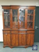 A reproduction mahogany breakfront bookcase,