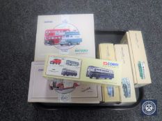 A tray containing eight boxed Corgi die cast buses and commercial vehicles