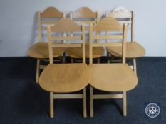 A set of five folding kitchen chairs