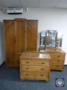A twentieth century oak three piece bedroom suite