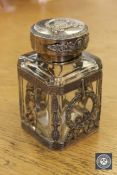 A presentation decanter with highly ornate silver mounts,