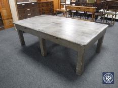 An early 20th century pine kitchen table