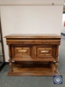 A 19th century oak marble topped buffet stand,