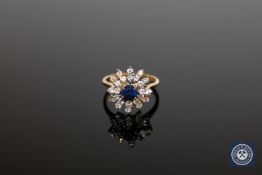 An 18ct gold diamond and sapphire cluster ring