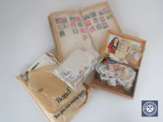 A tray containing a quantity of assorted stamps, photographs,