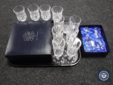 A tray of lead crystal whisky tumbler, six cut glass champagne flutes,