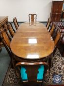 A 20th century Chinese extending dining room table, with two leaves,