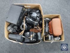 Two boxes of cameras,