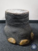 An elephant foot stick stand