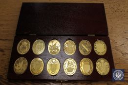 Twelve commemorative silver gilt ingots - The Arms of the Prince of Wales, in case.