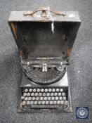A cased vintage Remington Home Portable typewriter