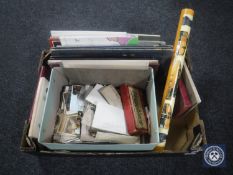 A box of postcards, photograph album, board games, Singer sewing machine, accessory book,