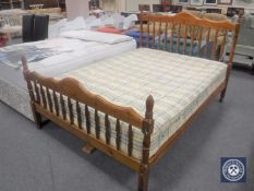 A 5' pine bed frame with Sleepvendor mattress