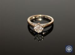 An 18ct gold diamond flower cluster ring, approximately 0.25ct, size L 1/2.