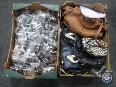 Two boxes containing assorted lady's leather hand bags and lip sticks