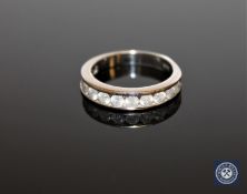 A 14ct gold twelve stone diamond half eternity ring, round brilliant cut stones approximately 1ct,