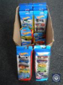 A box of boxed Hotwheels die cast vehicles