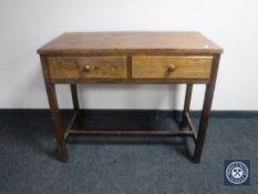 An early 20th century oak hall table fitted two drawers