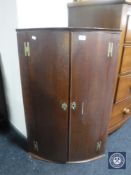 A 19th century oak double door corner cabinet