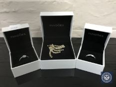 Two boxed Pandora rings and set of Pandora earrings