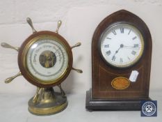 An Edwardian dome top inlaid mahogany mantel clock together with a ship's wheel barometer on stand