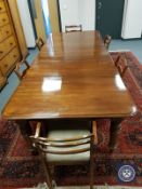 A Victorian mahogany extending dining room table, with three leaves, fully extended 303 cm x 121 cm,