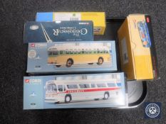 A tray containing seven boxed Corgi die cast buses