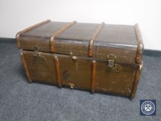 An early 20th century wooden bound travelling trunk