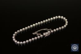 An 18ct white gold diamond tennis bracelet.