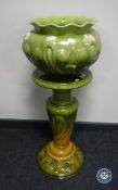 A Victorian glazed pottery jardiniere stand and a Bretby pottery planter a/f