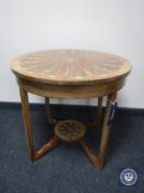 A circular Victorian inlaid mahogany occasional table