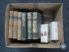 A box containing three Dickens volumes, other antiquarian volumes including Life of Gladstone,
