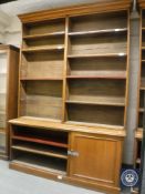 A Victorian oak bookcase fitted with a panelled cupboard below, width 201 cm,