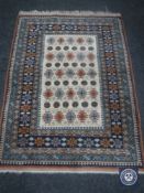 A fringed Caucasian design rug