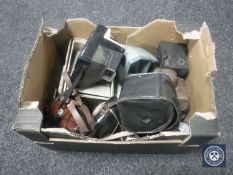 A box of vintage cameras