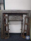 A cast iron fire inset, with two side panels.