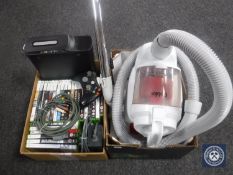 Two boxes containing an Xbox 360 together with approximately 25 games, leads and accessories,