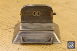 A silver desk calendar,