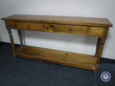 A contemporary hardwood two tier side table fitted two drawers