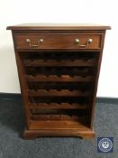 An Indonesian mahogany wine cabinet fitted a drawer