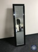A contemporary all glass bevelled cheval mirror